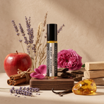 Alexandria perfume oil surrounded by apple, cinnamon, rose, oud and sandalwood